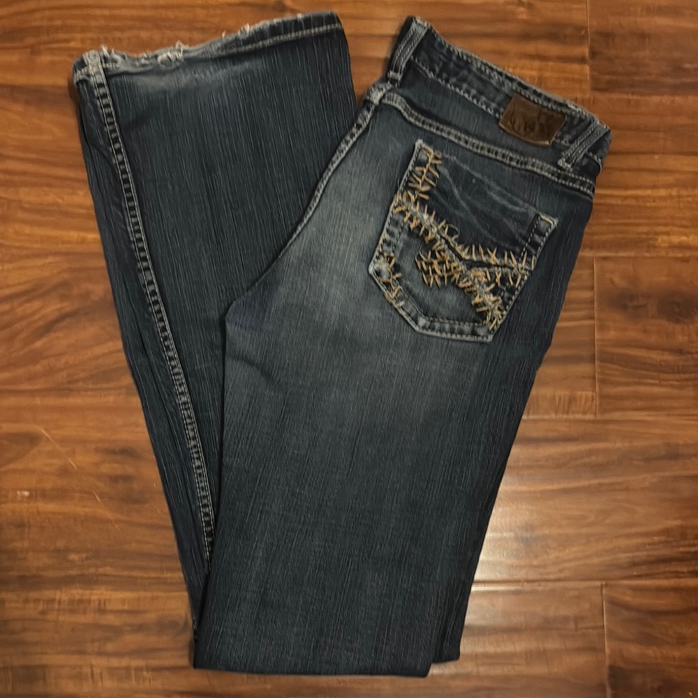 BKE Blue Boot Cut Jeans with Distressing and Embroidered Design
